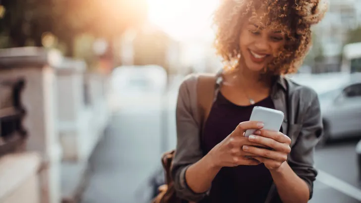Photo of a woman using smart phone
