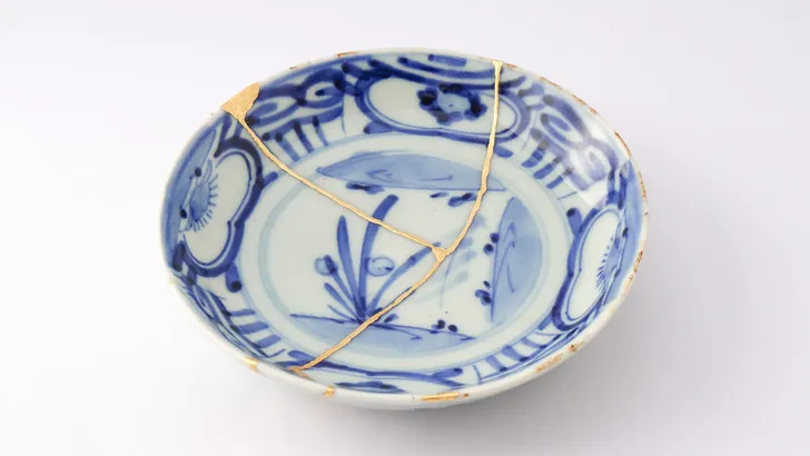 Antique broken Japanese plate repaired with gold kintsugi technique