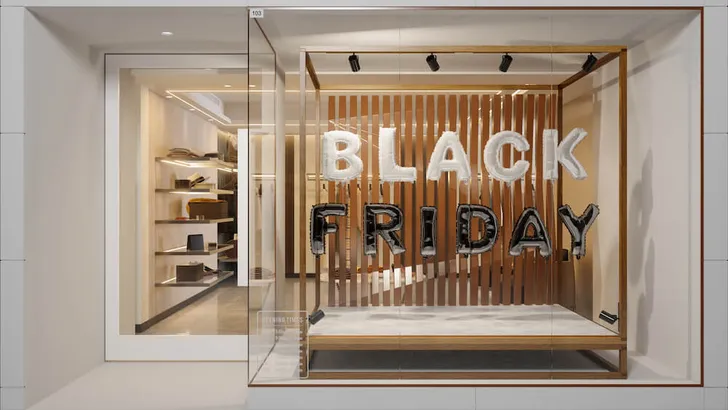 Exterior Of Clothing Store With White And Black Colored Black Friday Text Balloons
