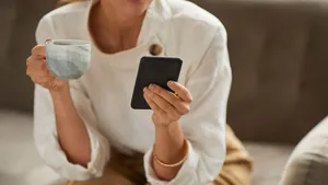 Successful Businesswoman Holding Smartphone Close Up