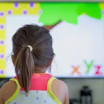 Children watching tv at home. Preschool education.