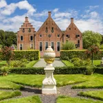 Garden and historic building of the Menkemaborg in Groningen