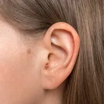 Close up of human head with female ear