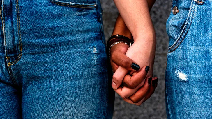 Close up of hands of diverse races.