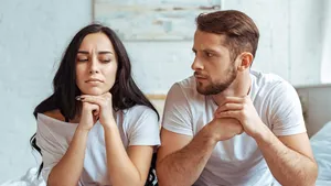 handsome man in jeans and beautiful woman in t-shirt sitting on