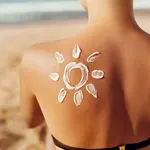 Skin care. Sun protection. Woman apply sun cream. Woman With Suntan Lotion On Beach In Form Of The Sun. Portrait Of Female With  Drawn Sun On A Shoulder. Suncream. Girl Holding Moisturizing Sunblock.