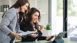 girl working together offer ideas to each other
happy young business colleagues working in the office