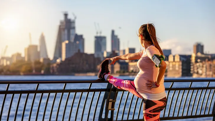 Pregnant woman does her stretching in London