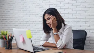 Desperate businesswoman worried in office