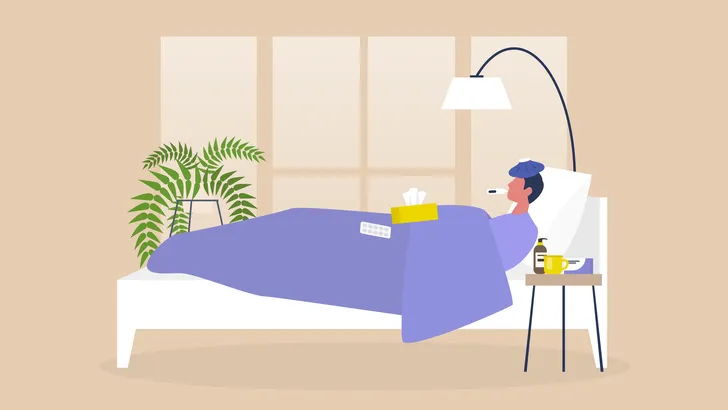 Een man ligt ziek op bed.