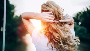 Blond girl standing at the bridge