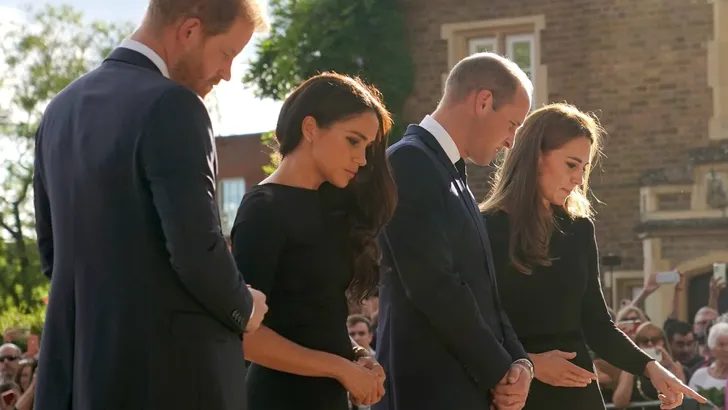 The Prince and Princess of Wales and the Duke and Duchess of Sussex viewing the messages and floral tributes