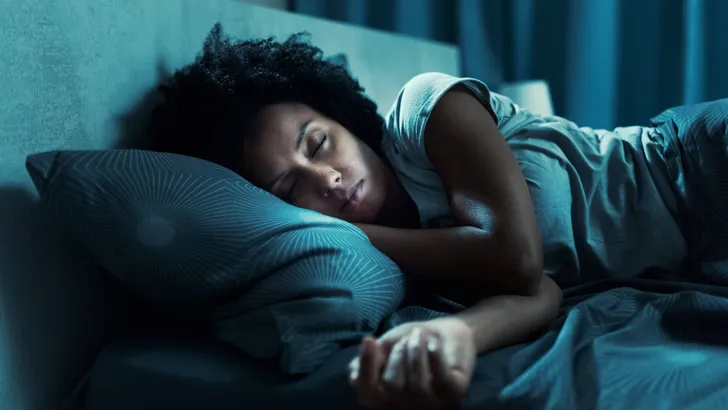 African american woman sleeping in her bed
