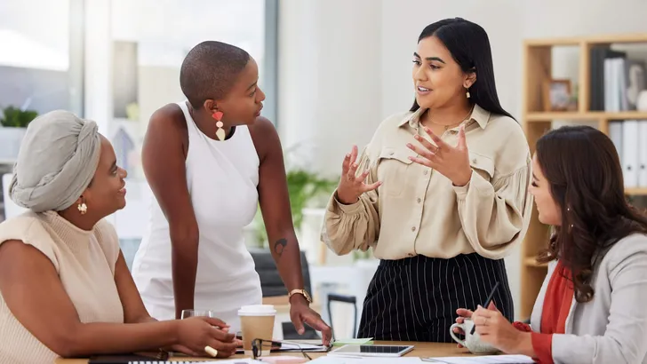 Diverse group, teamwork and young business women brainstorming, collaboration or cooperation. Ambitious confident professional team of colleagues talking and planning a marketing strategy together