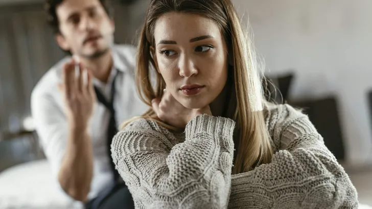 Angry man is yelling at his wife.