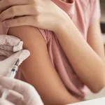 Doctor Vaccinating Little Girl Close Up