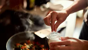 Young woman cooking in the kitchen