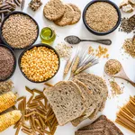 Dietary fiber: large group of wholegrain food shot from above on white background