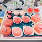 Sweet pastel peach and pink colorful set of afternoon tea in Sakura or Cherry Blossom theme. Tasty and delicious dessert, savories, bakery and pastry. Good for high tea party or Birthday celebration.