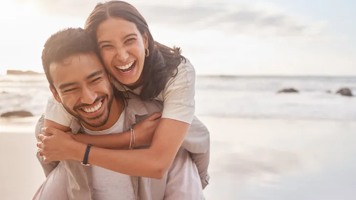 Shot of a couple enjoying a day at the beach