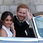 Meghan Markle leaving Windsor Castle with Prince Harry after their wedding to attend an evening reception at Frogmore House