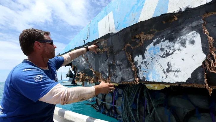 December 21, 2014. Team Vestas Wind boat is moved from St Brandon Island &#8211; Mauritius and load…