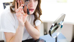 Woman sitting by the mirror