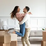 Overjoyed couple dancing excite to move in together