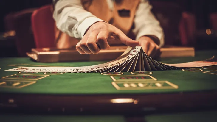Croupier behind gambling table in a casino
