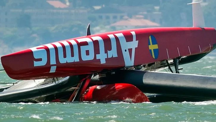 APTOPIX Americas Cup Capsized Boat Sailing