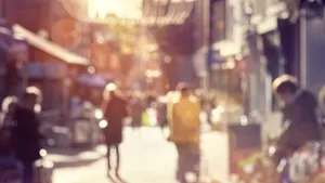 Crowd of blurred shoppers walking and shopping on a high street