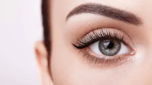 Female eye with long false eyelashes