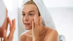 Woman Applying Moisturising Creme on Her Face