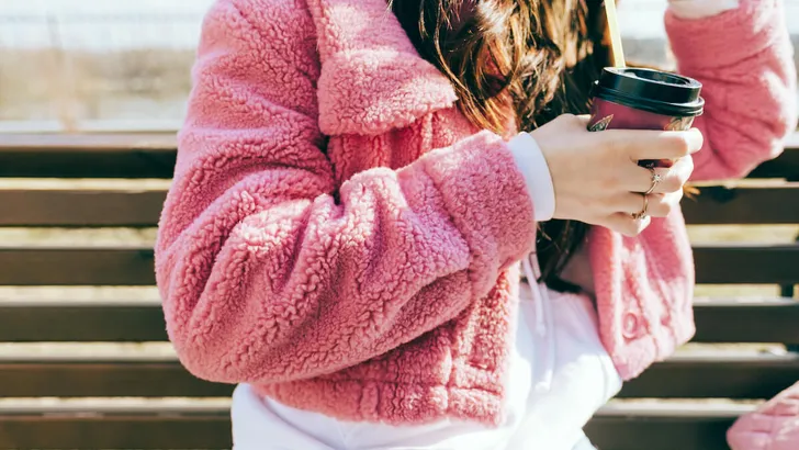 Young stylish woman in pink jacket, close-up shot. Youth culture