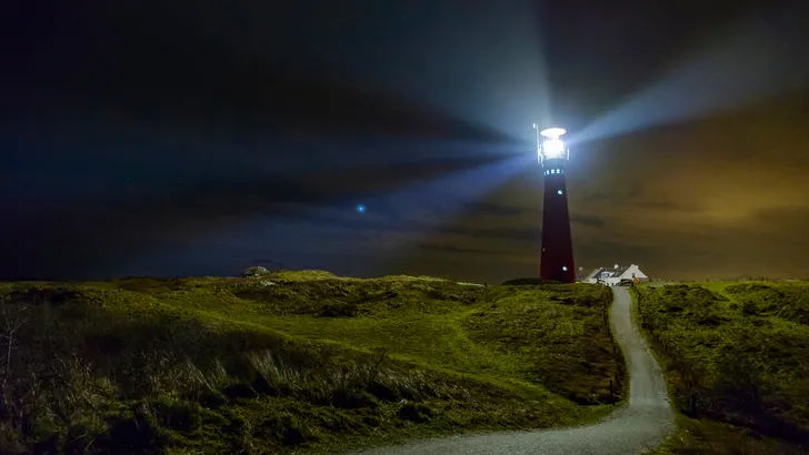 Lighthouse in the night at Schiermonnikoog island in The Netherlands