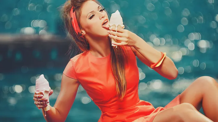 woman eating melted  ice-cream