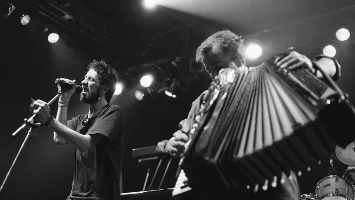 Shane MacGowan (left) performs with the Pogues 