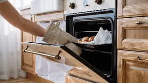 housewife baking fresh homemade bun for breakfast