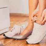 business woman changing to sports shoes