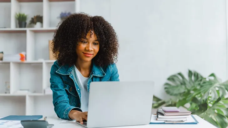 Close up portrait beautiful woman smiling and using laptop compu