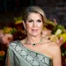 Koningin Máxima in groene jurk waarmee ze tijdens staatsbezoek aan Suriname de vlag compleet maakt.