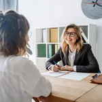 Young female candidate interviewed by employer