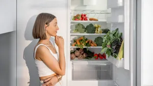 Woman with healthy vegetables in the fridge
