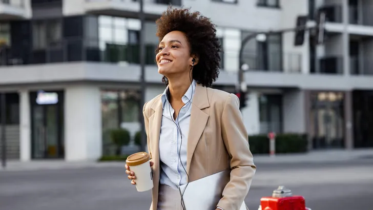 Well dressed woman  walking on the street after work