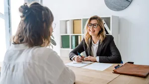 Young female candidate interviewed by employer