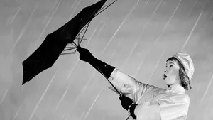 1950s WOMAN IN RAIN storm