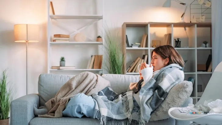 Sick tea virus drinking shivering woman cup healing
