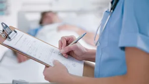 Nurse tending patient in intensive care