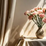 carnation flowers bouquet in vase on neutral beige empty wall and linen curtain with aesthetic floral sunlight shadow background spring or summer home interior decor