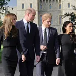 The Prince and Princess of Wales and the Duke and Duchess of Sussex viewing the messages and floral tributes